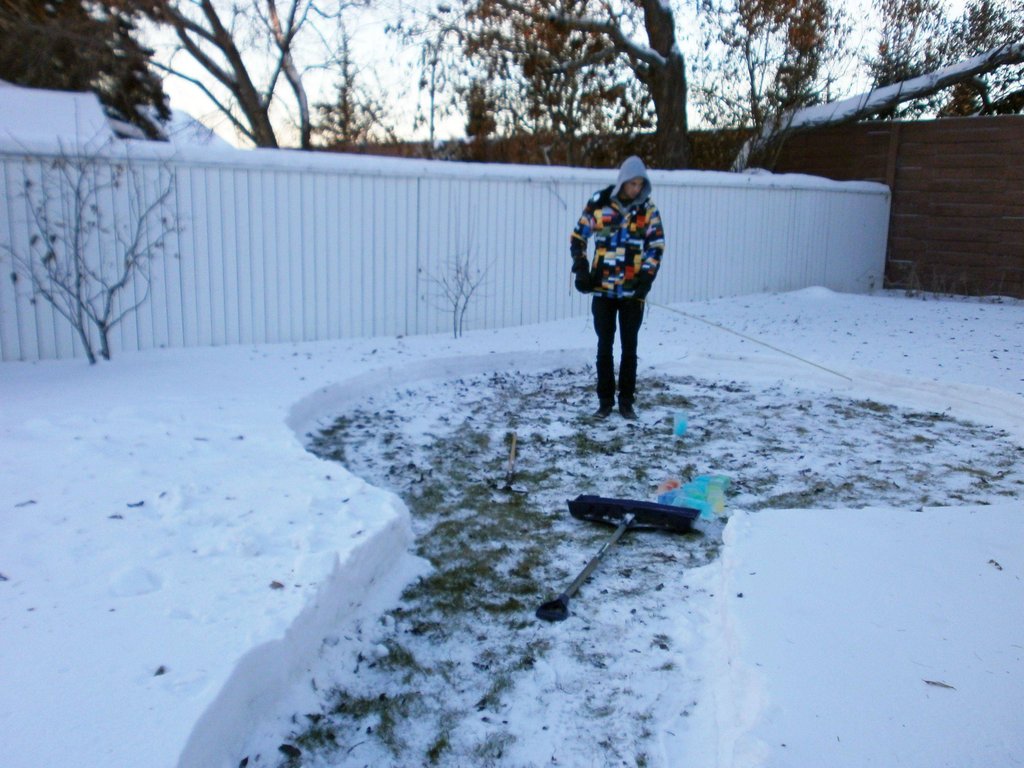 They started out by clearing out some snow to create space.