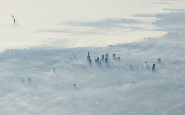 warsaw-poland-covered-in-fog-from-an-airplane-aerifal-from-above