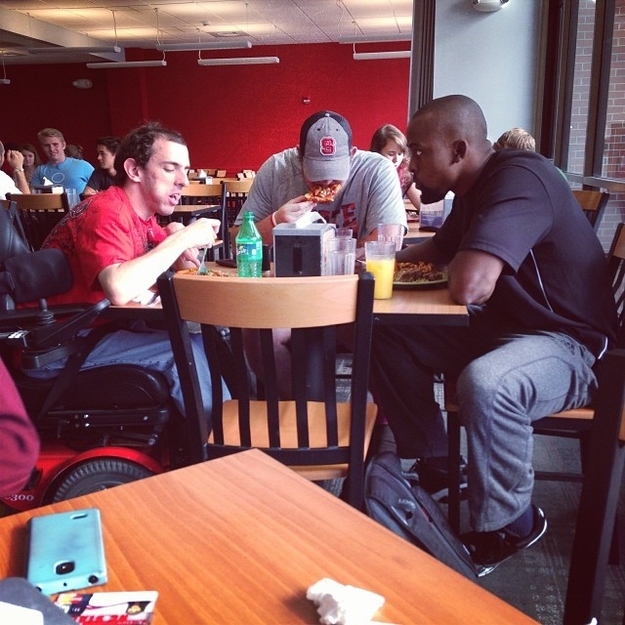This picture of two football players who didn't want this student to eat alone.
