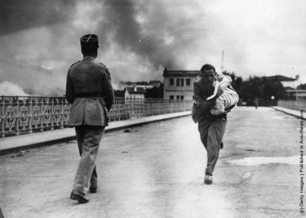 17.) A journalist saves a child during the Spanish Civil War in 1936.