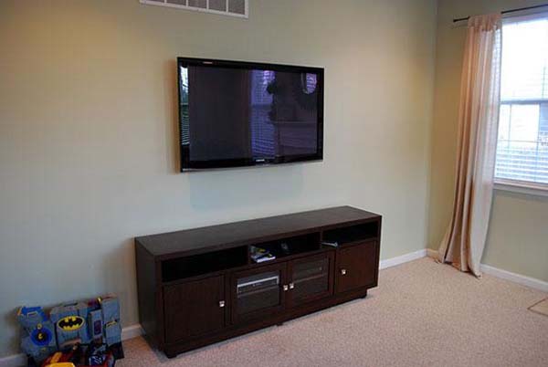 12.) Hang a painting over a TV when it's not in use.