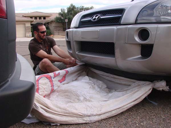 The dress worked surprisingly well as a tow rope (helping him tow an SUV for over a mile).