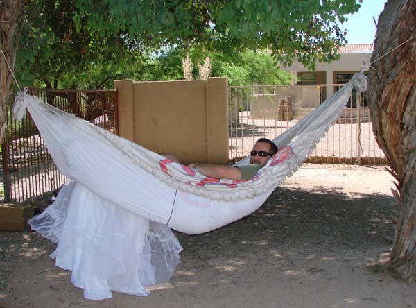 He didn't think the dress-hammock would support his weight, but voila: one of the best uses for the dress yet.