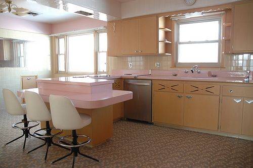 The kitchen as a whole, just as it appeared when the house was built more than 50 years ago. The theme is pink!