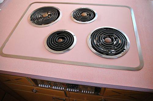 The burners on the electric stove also came with little silver caps for when they weren't in use.