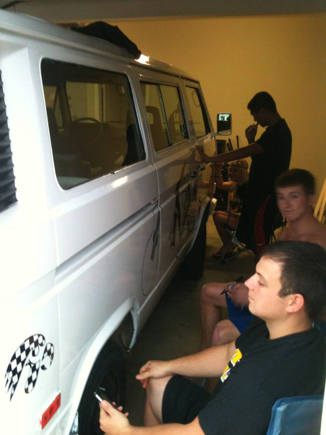 Some good-natured folks came in and got down to adding their own designs to the van's white canvas.