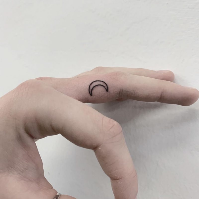 crescent moon tattoo finger