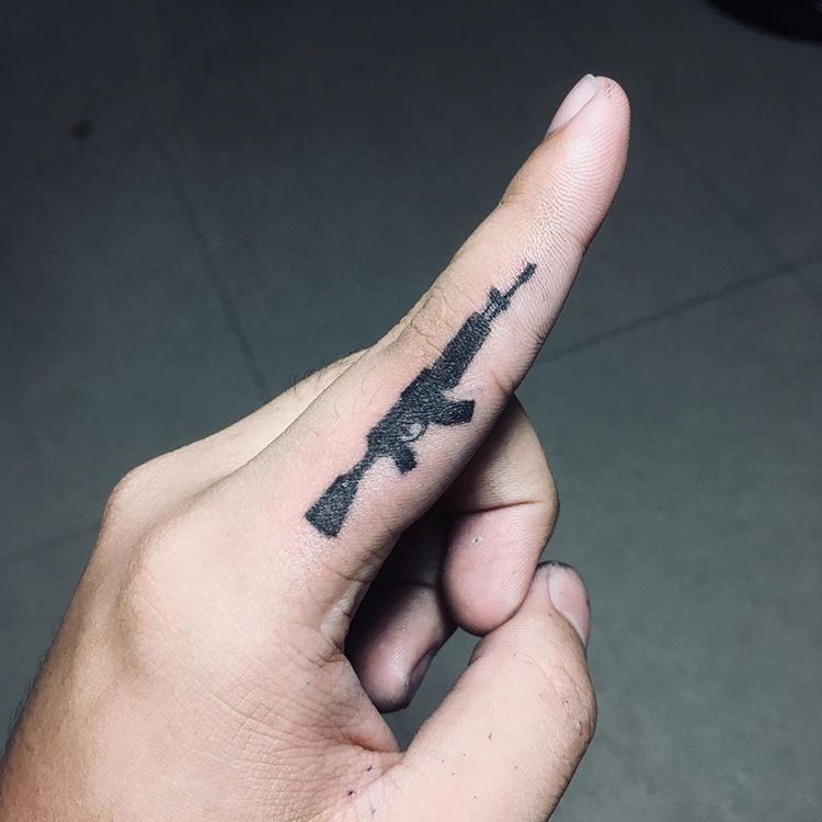 23.gun .finger.tattoo