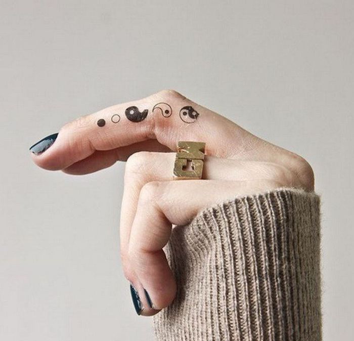 28.yin yang middle finger tattoo golden ring lion finger tattoo black nail polish
