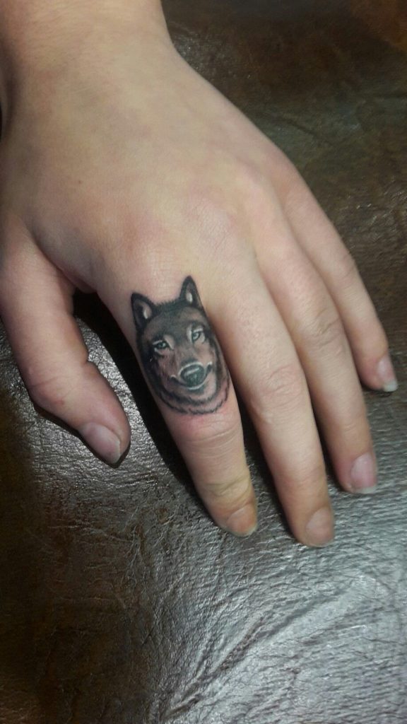38.wolf .finger.tattoo