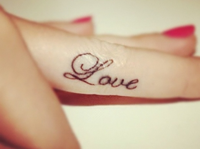 49.Love Tattoo On Finger Side For Girls