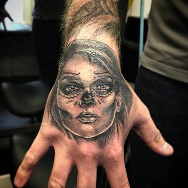 25 Frighteningly Cool Skeleton Hand Tattoo Designs