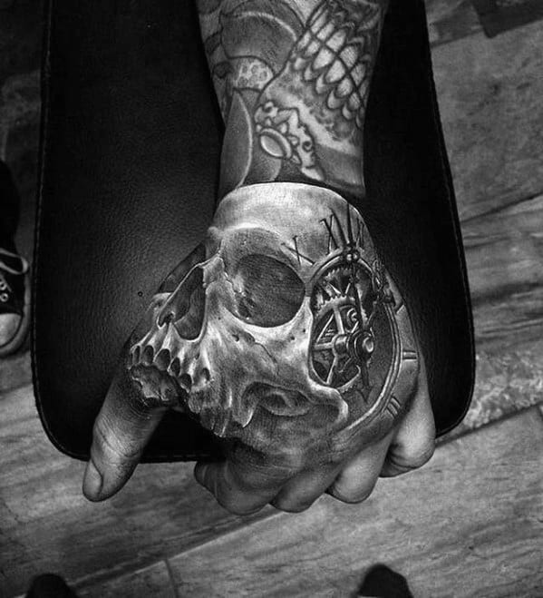 Why Do So Many People Have This Skull Hand Tattoo