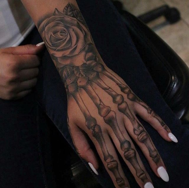 20 fascinating skeleton hand tattoo ideas to decorate your skin  YENCOMGH