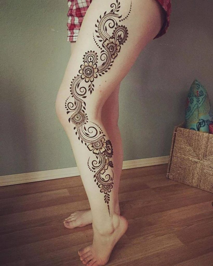 Ornate henna tattoo adorns young woman leg generated by AI 24575716 Stock  Photo at Vecteezy