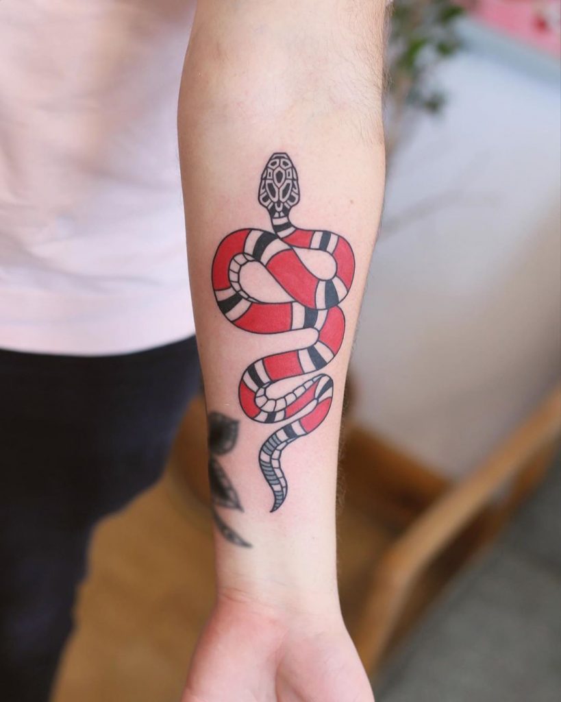 Gucci snake tattoos done by Tommy. - Sacred Society Tattoo