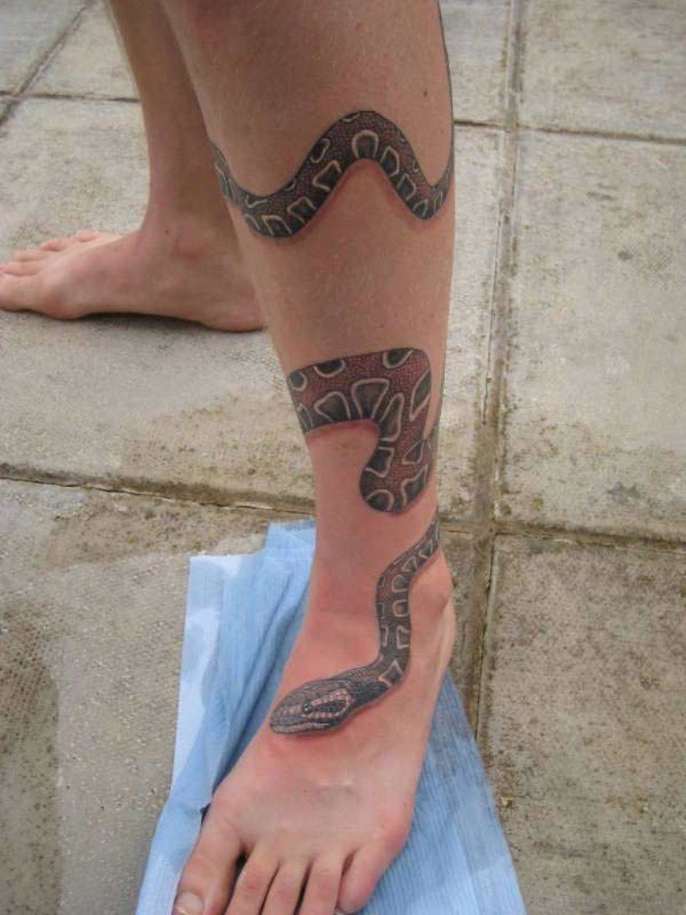 A snake wrapping around a hand  tattoos male and female Photo