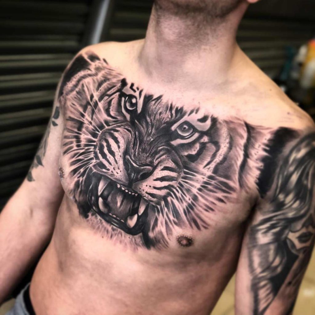 tribal lion chest tattoos