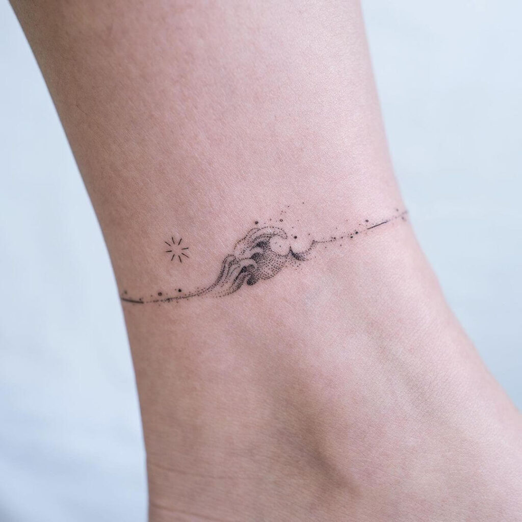 25 Cool Ankle Tattoos For Women Pulptastic 2022   9. Wave Ankle Tattoo 