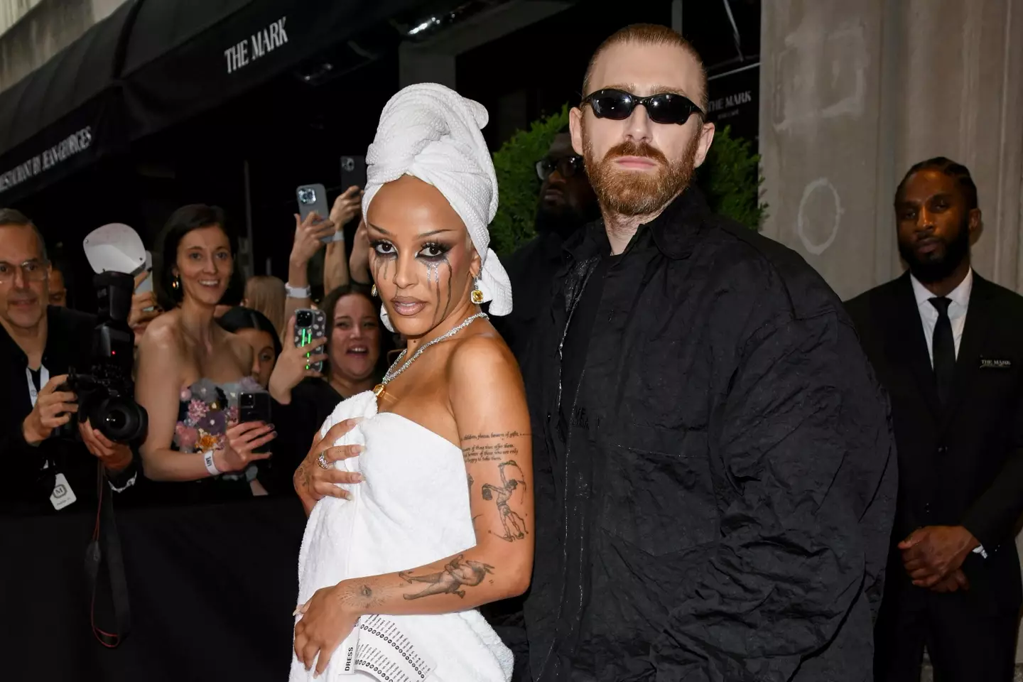 Doja Cat started off in a towel ensemble (Kristina Bumphrey/WWD via Getty Images)