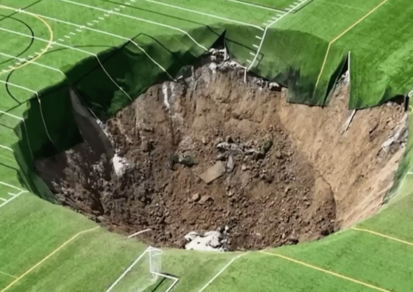 According to local reports, the sinkhole was caused by an underground mine owned by New Frontier Materials. (KSDK News)