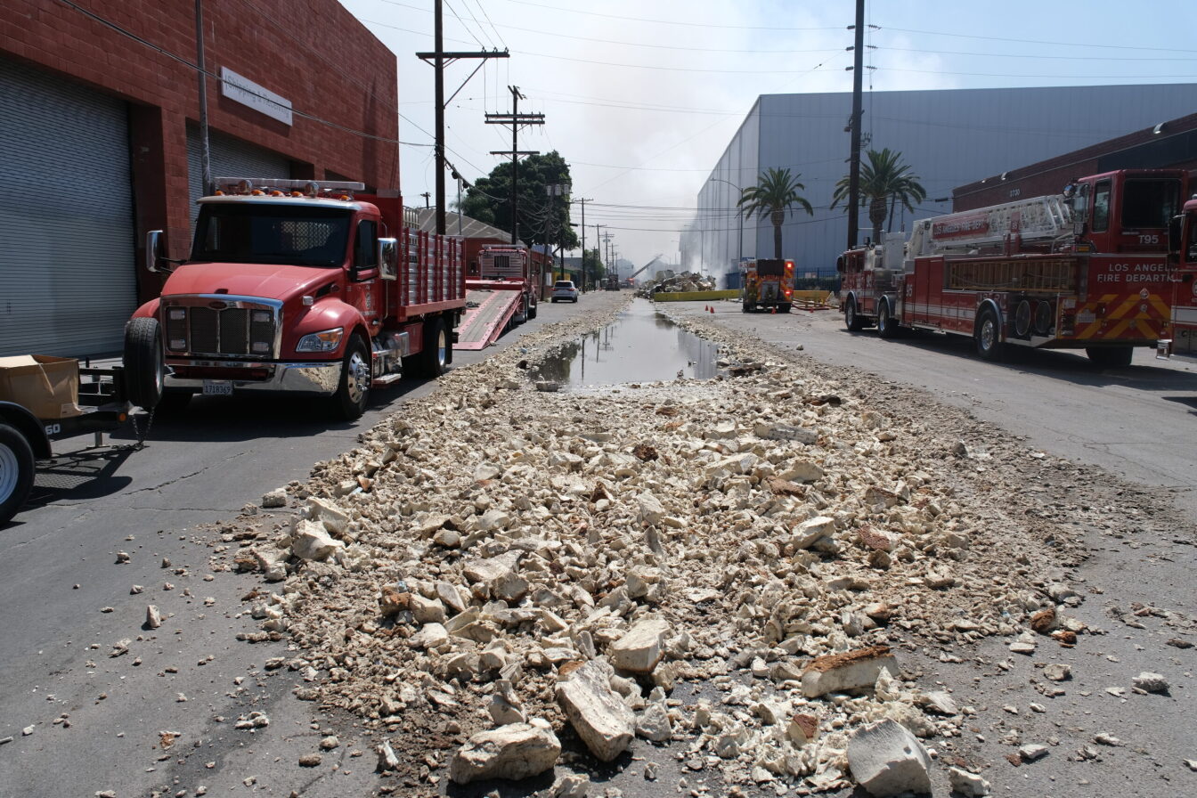 Plans quietly laid to rebuild burned LA warehouse after Mayor Karen Bass vowed company would never return