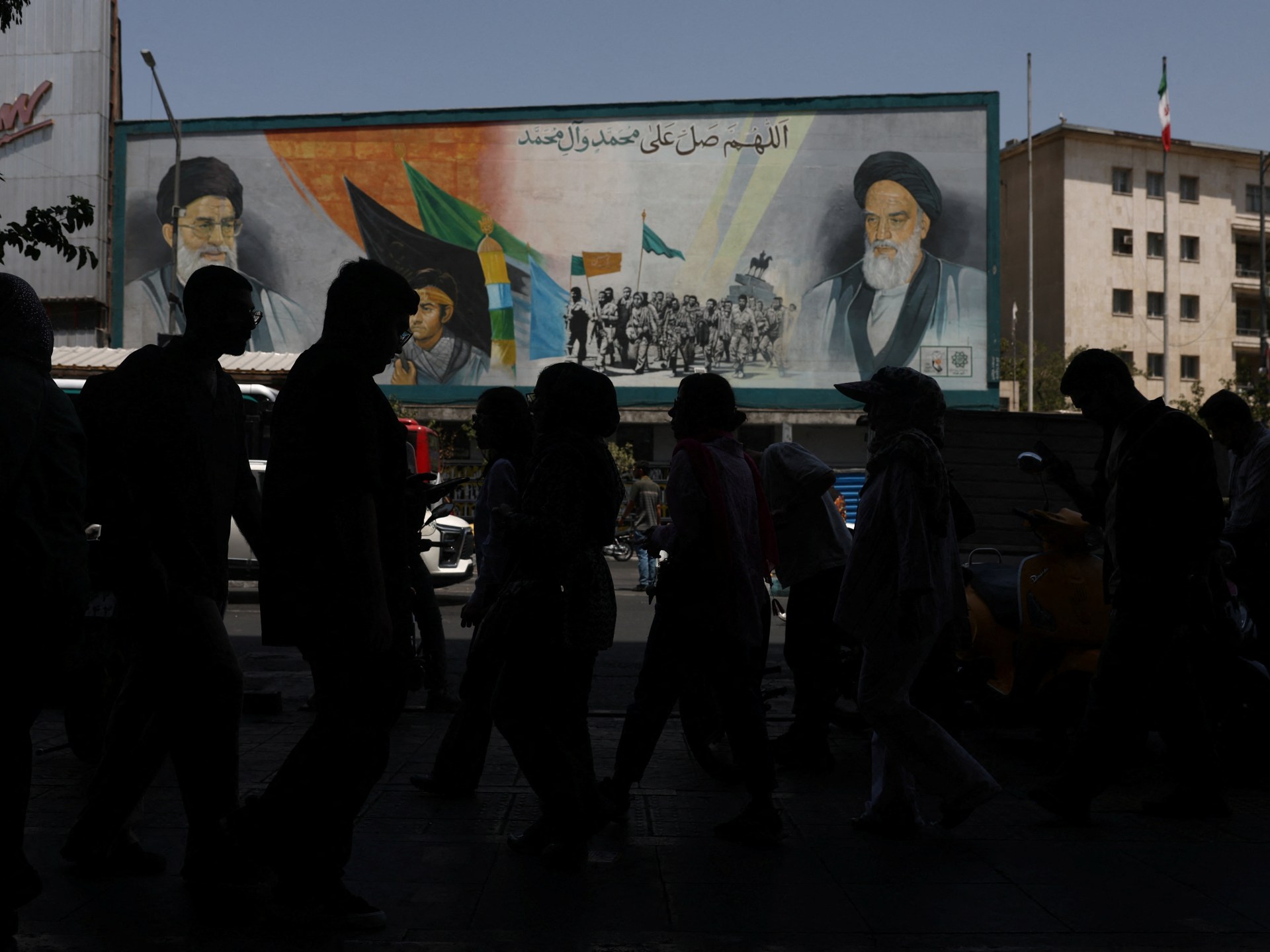 US strikes bridges and collapses a tower at a key port as its Iran campaign expands