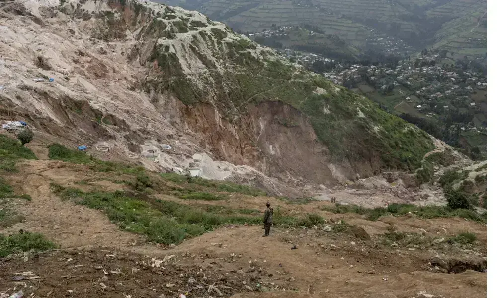 Residents gathered as rescue teams work at the landslide site