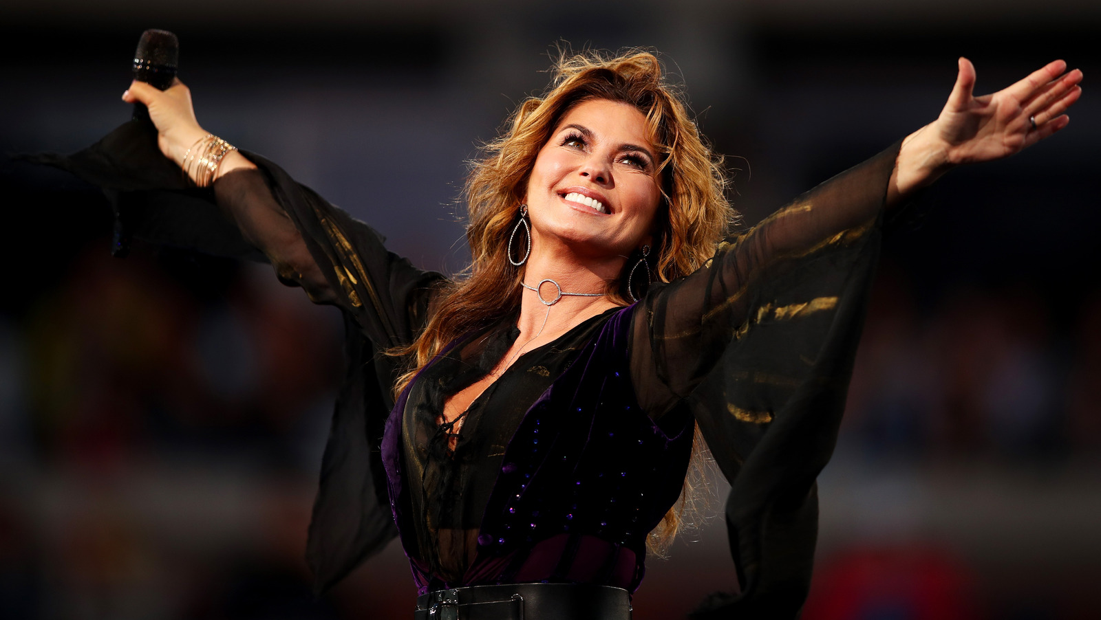Shania Twain, a country music superstar reflecting on her childhood trauma in recent interviews