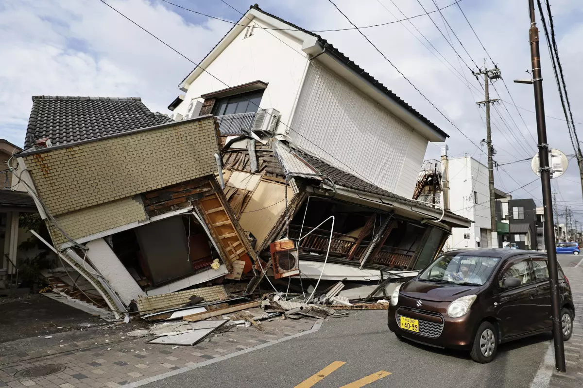 Rescuers haul survivors from wrecked Japanese mall after deadly earthquake