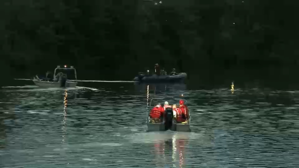 A first responder coordinating rescue efforts at the Passaic River