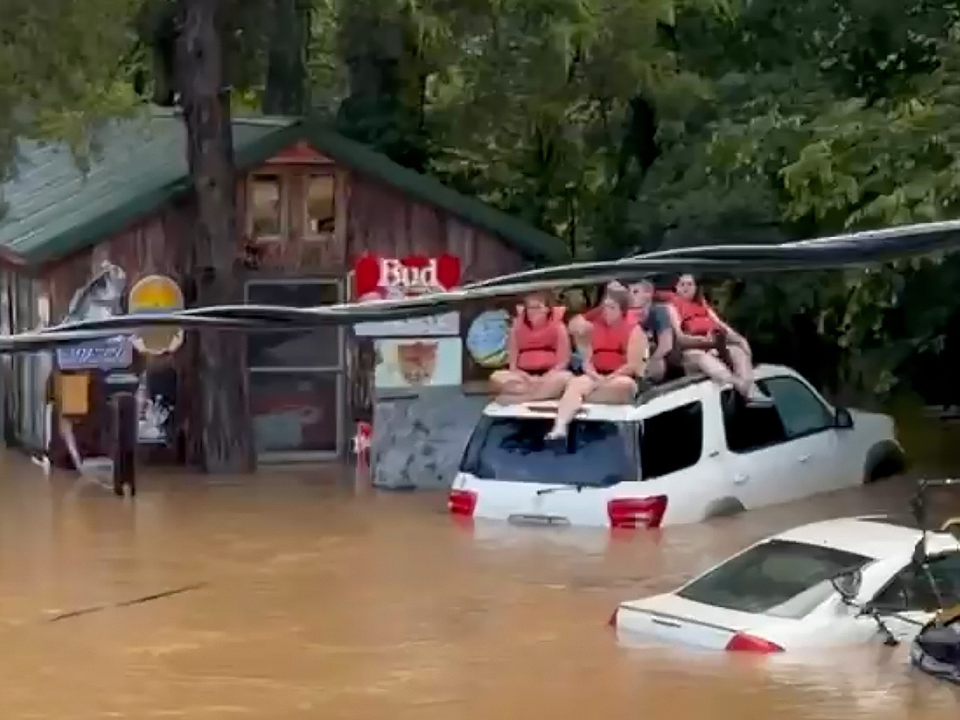 Emergency crews rescue about 20 after a campground building collapses in Missouri flooding