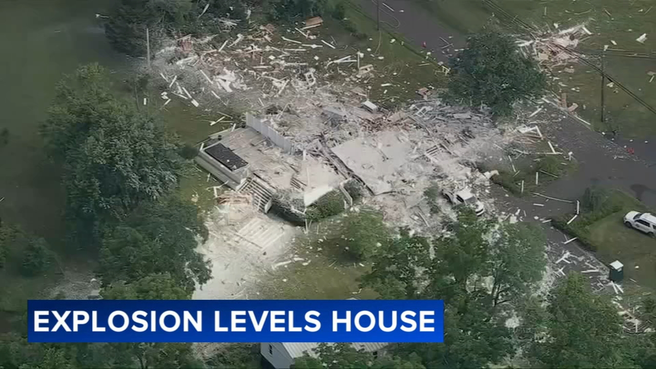 Debris field scattered across the neighborhood after the explosion