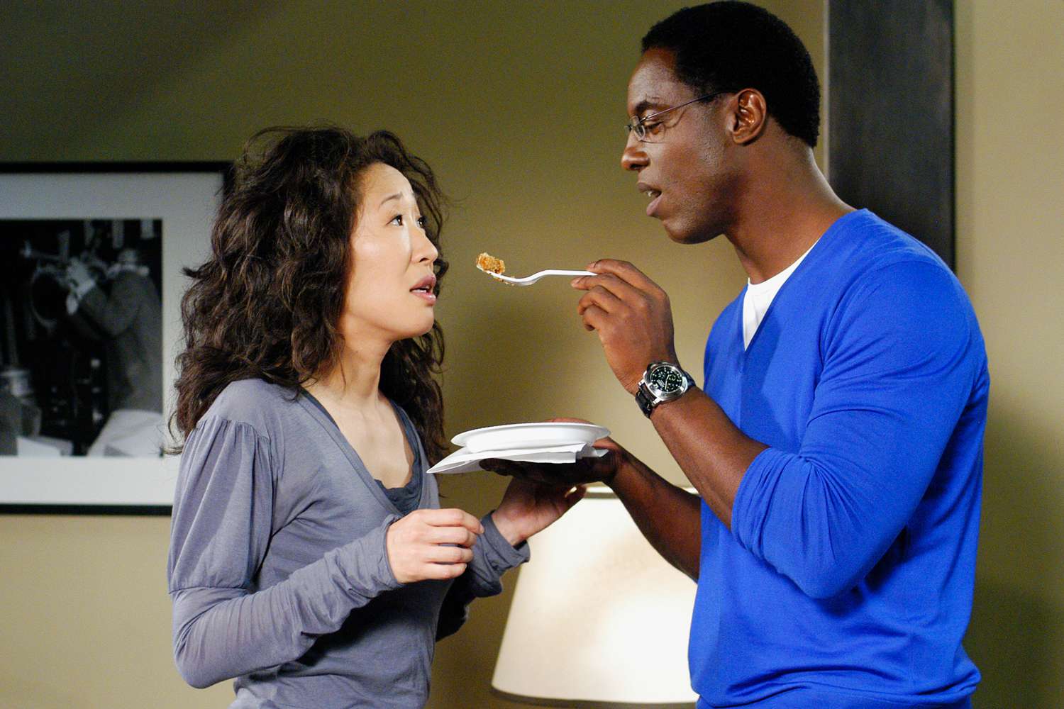 Sandra Oh on set of Grey's Anatomy in scrubs as Cristina Yang