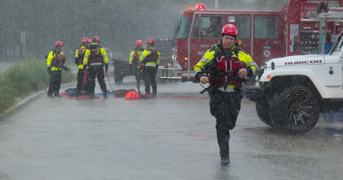Texas flooding surges from huge rainstorms as rescuers pull people from rising waters