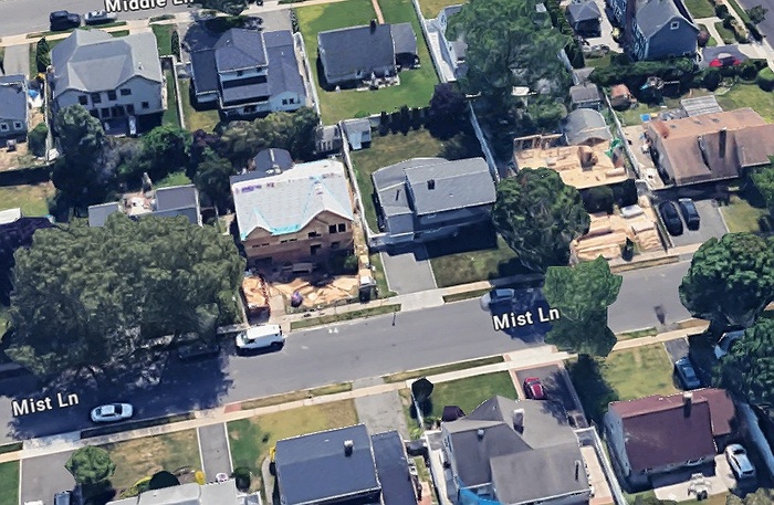 First responders arriving at a Westbury home where chickens were discovered