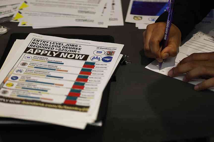 US filings for unemployment aid fall to 187,000 last week, fewest since 1969