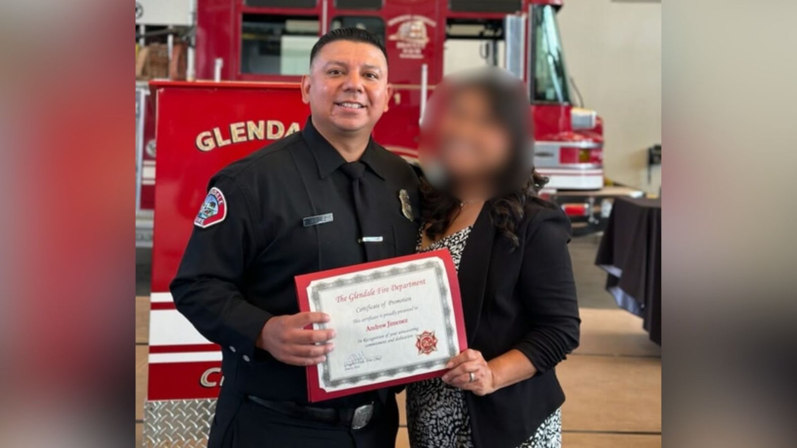 Stone-faced firefighter accused of axing his wife to death appears in court