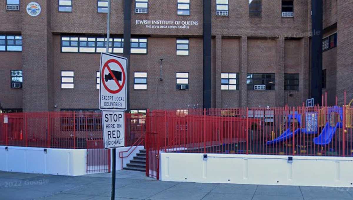 Security personnel at the Jewish Institute of Queens responding to the incident.