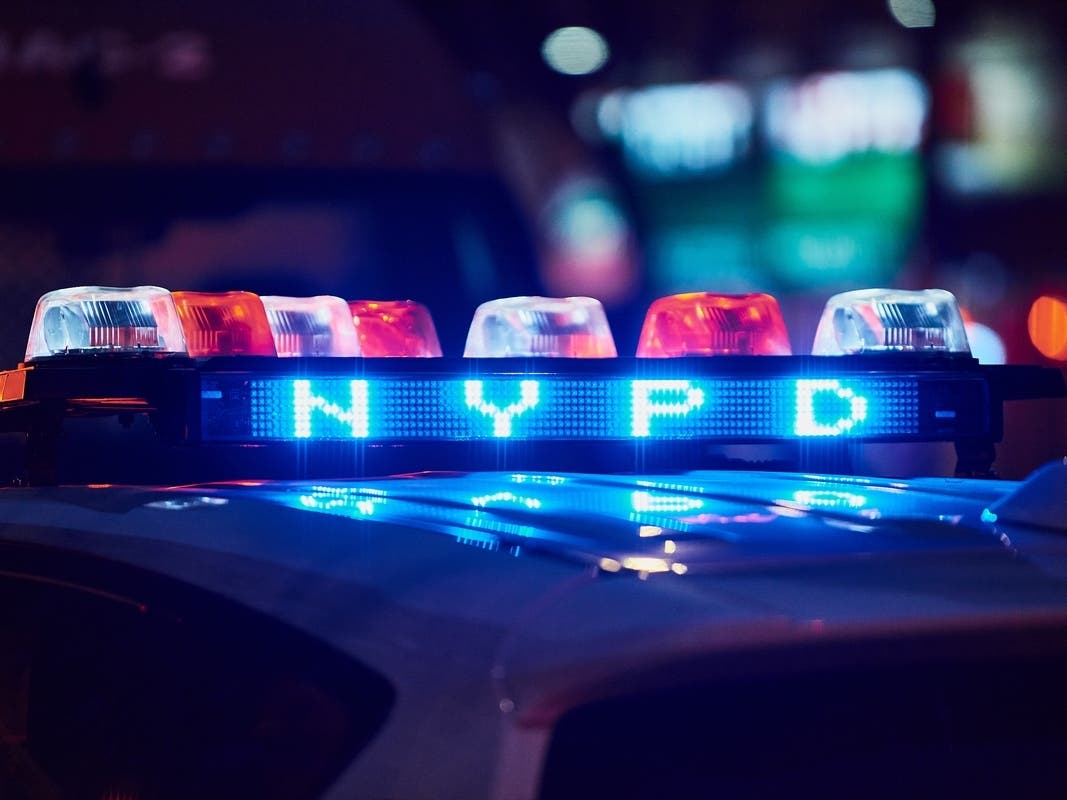 A black Chevrolet Tahoe SUV driver at the scene of the collision