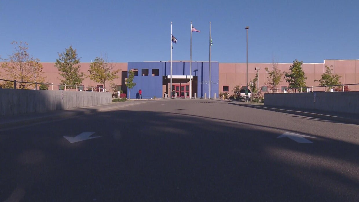 Off-duty employee arrested in shooting near ICE detention center in Colorado that injured a woman
