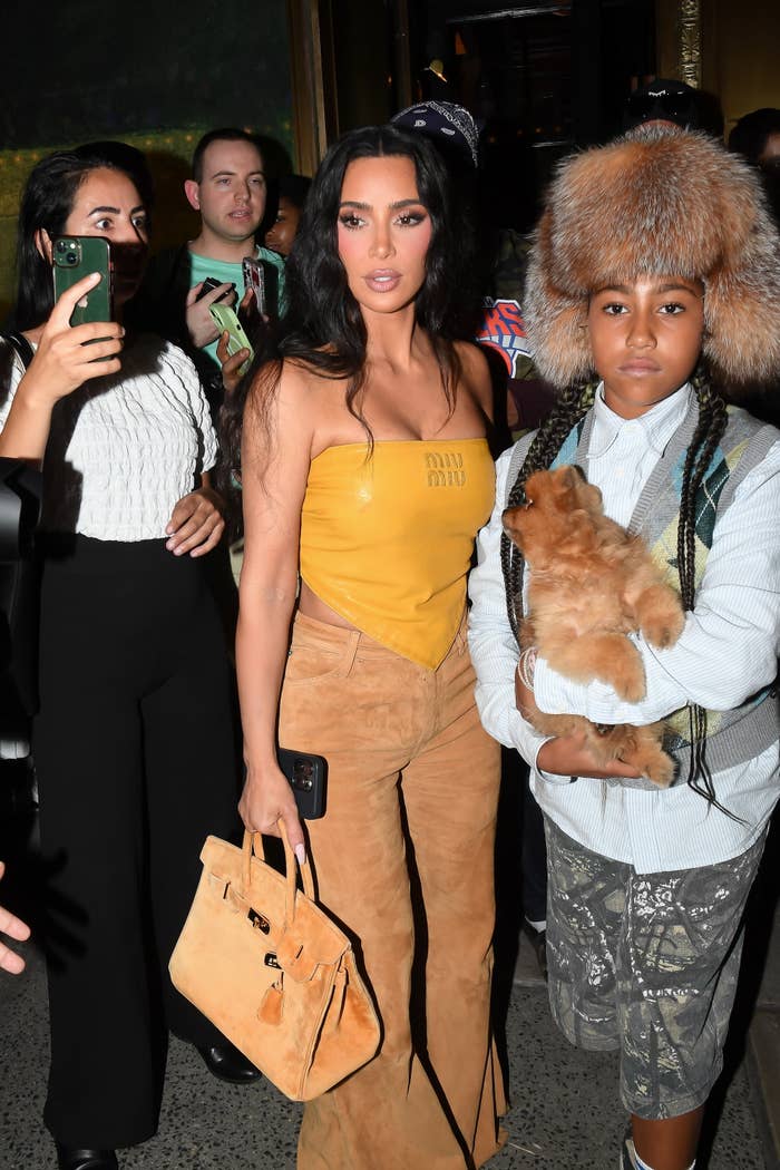 North West with angel bite lip piercings and facial dermals at Paris Fashion Week