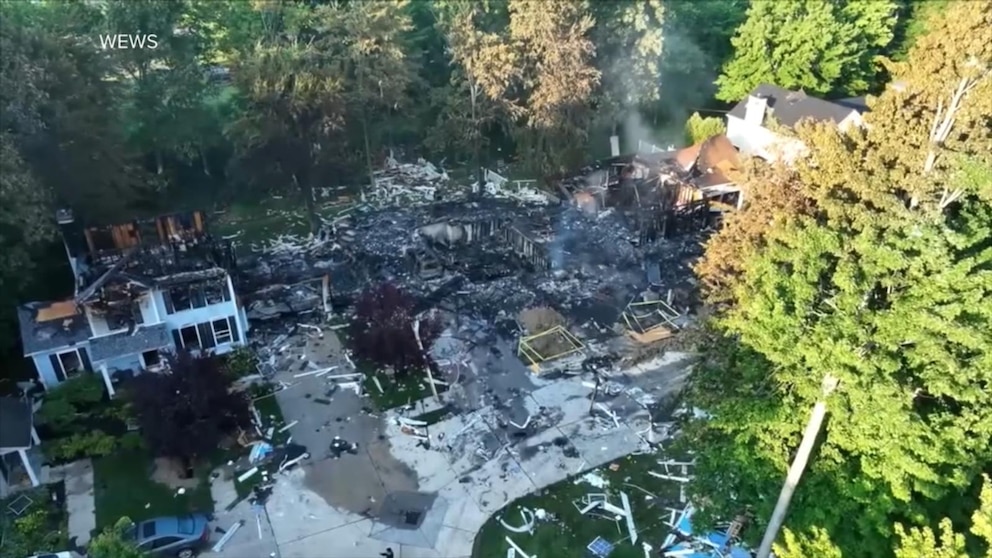 Fire officials at the scene of a home explosion in Canton, Ohio
