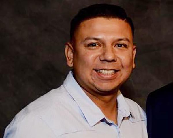 Stone-faced firefighter accused of axing his wife to death appears in court