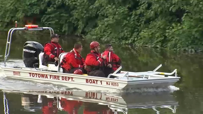 Rescue boats and equipment deployed on the Passaic River during search operations