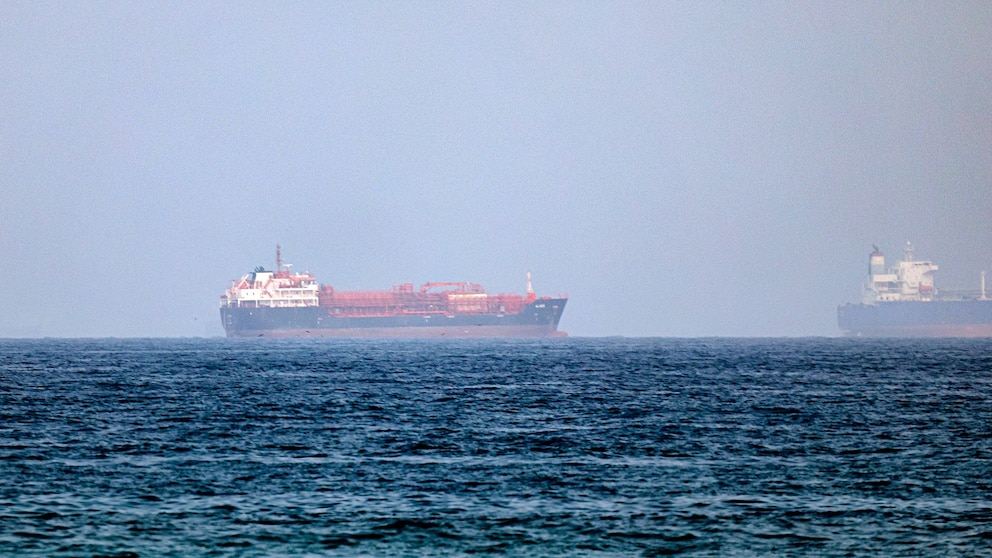 Oil prices jump following fighting with Iran, while sinking AI stocks drag Wall Street lower