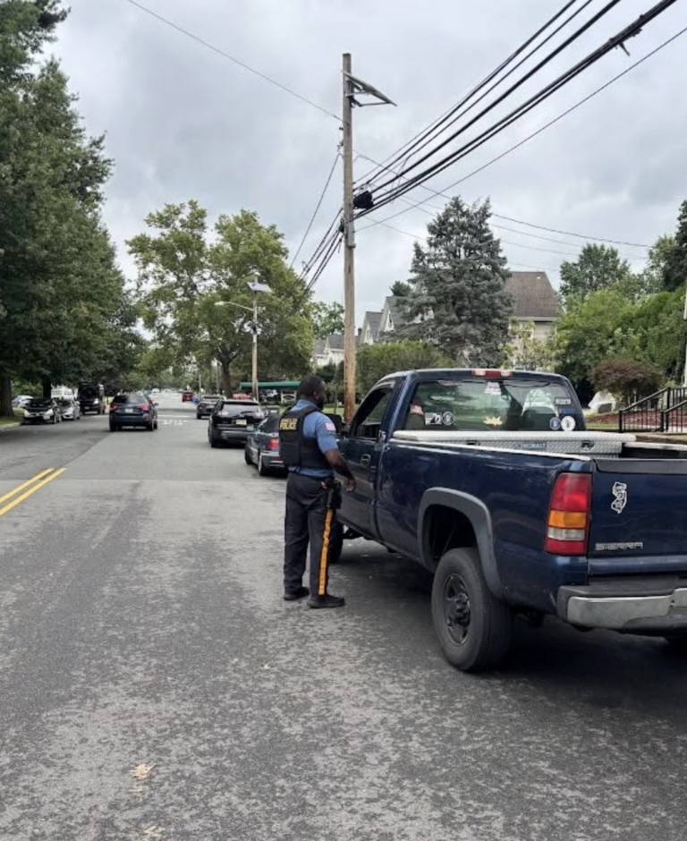 Dunellen Police Department officer in shrub costume during enforcement operation