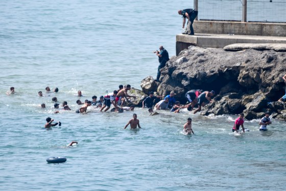‘Absolute chaos’ as thousands of people breach Morocco’s border with Spain’s Ceuta