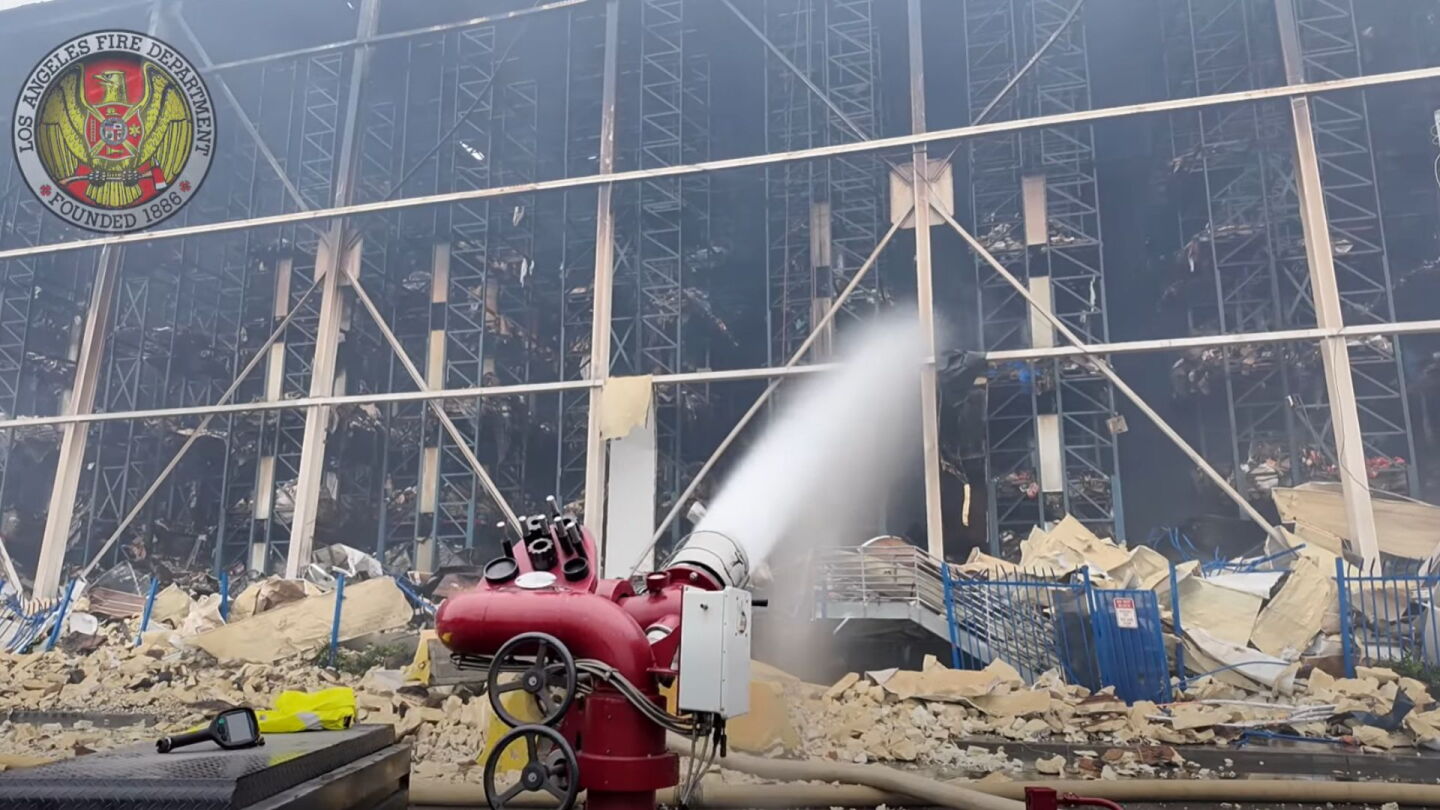 Plans quietly laid to rebuild burned LA warehouse after Mayor Karen Bass vowed company would never return