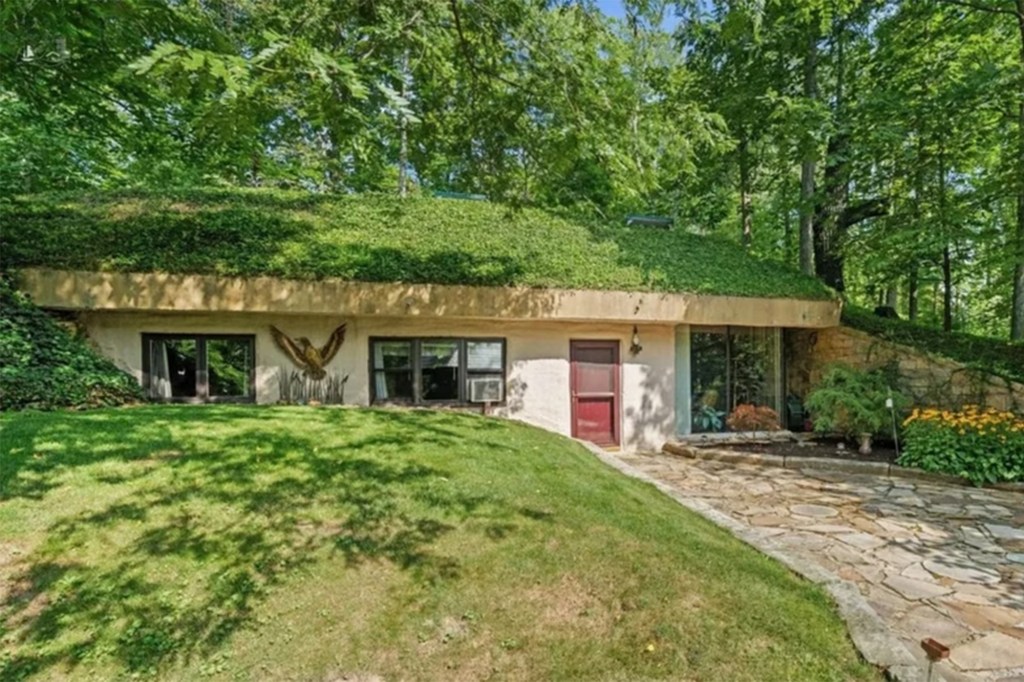 Earth-sheltered Ohio home that is built almost entirely underground comes with a roof you have to mow